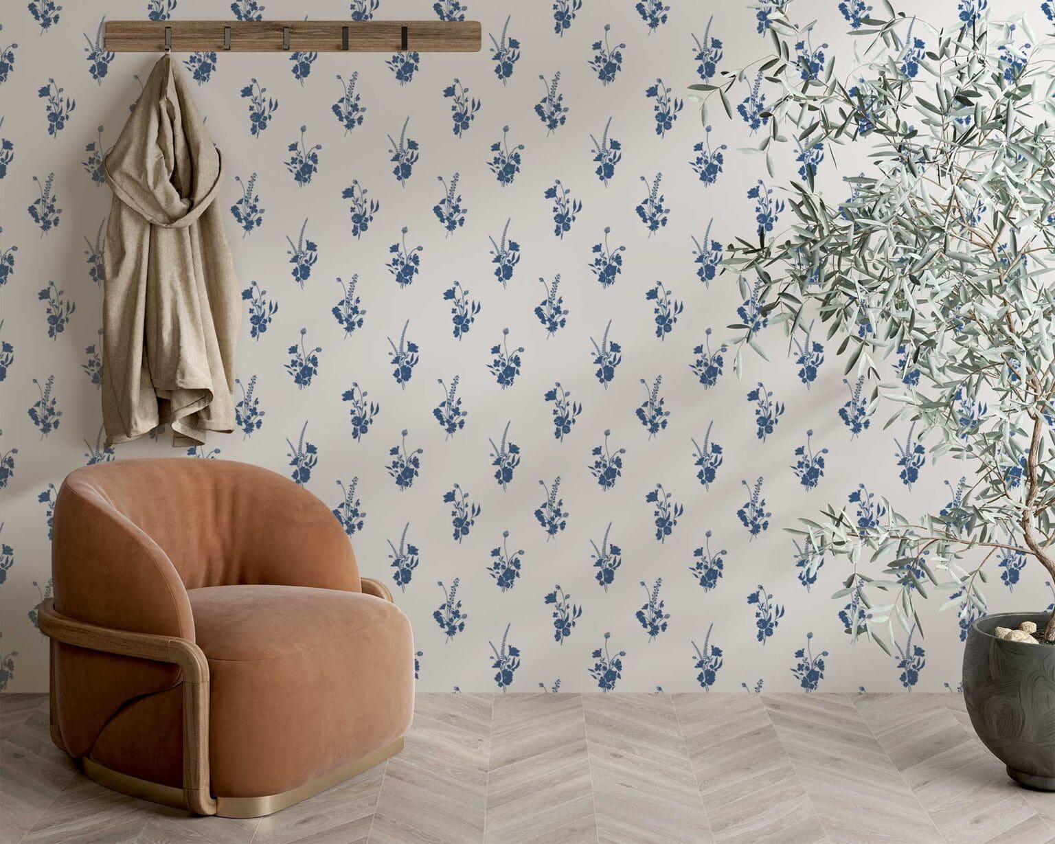 Wall with indigo floral wallpaper with an orange chair and a potted tree in front