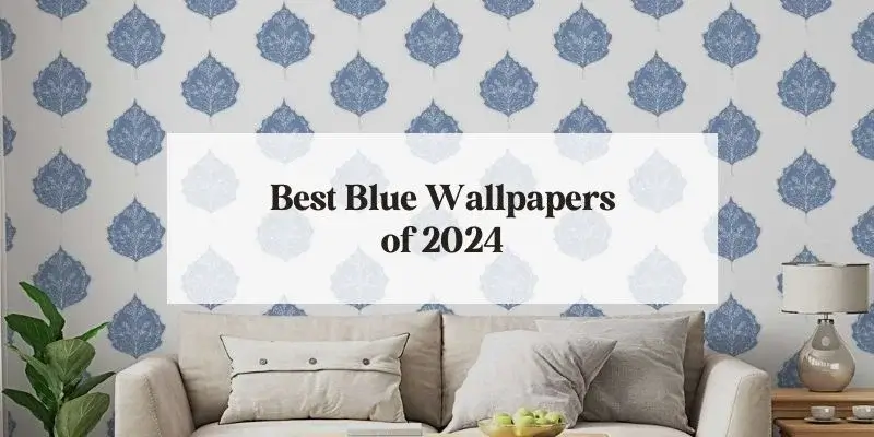 Best Blue Wallpapers 2024 text over a photo of a living room with blue wallpaper and an linen sofa.