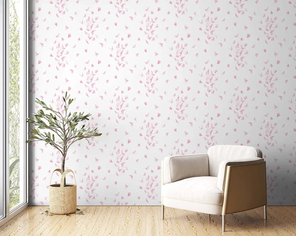 Butterfly Dance wallpaper in Bubble Gum Pink with a modern white linen chair and plant in a basket on the floor next to a window.