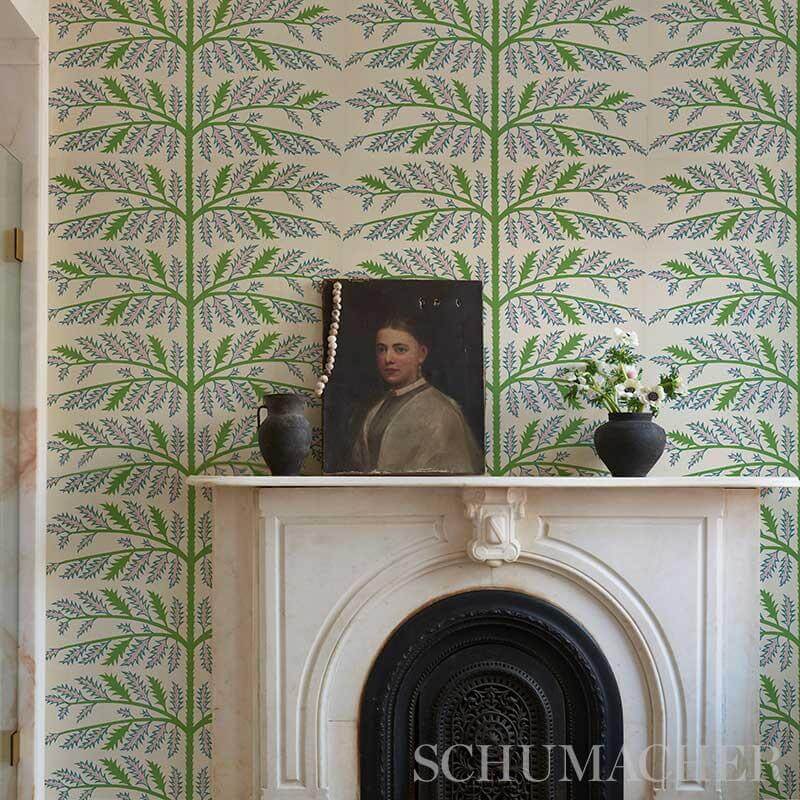 Schumachers Thistle Rose wallpaper in lavender above a stone fireplace mantle.