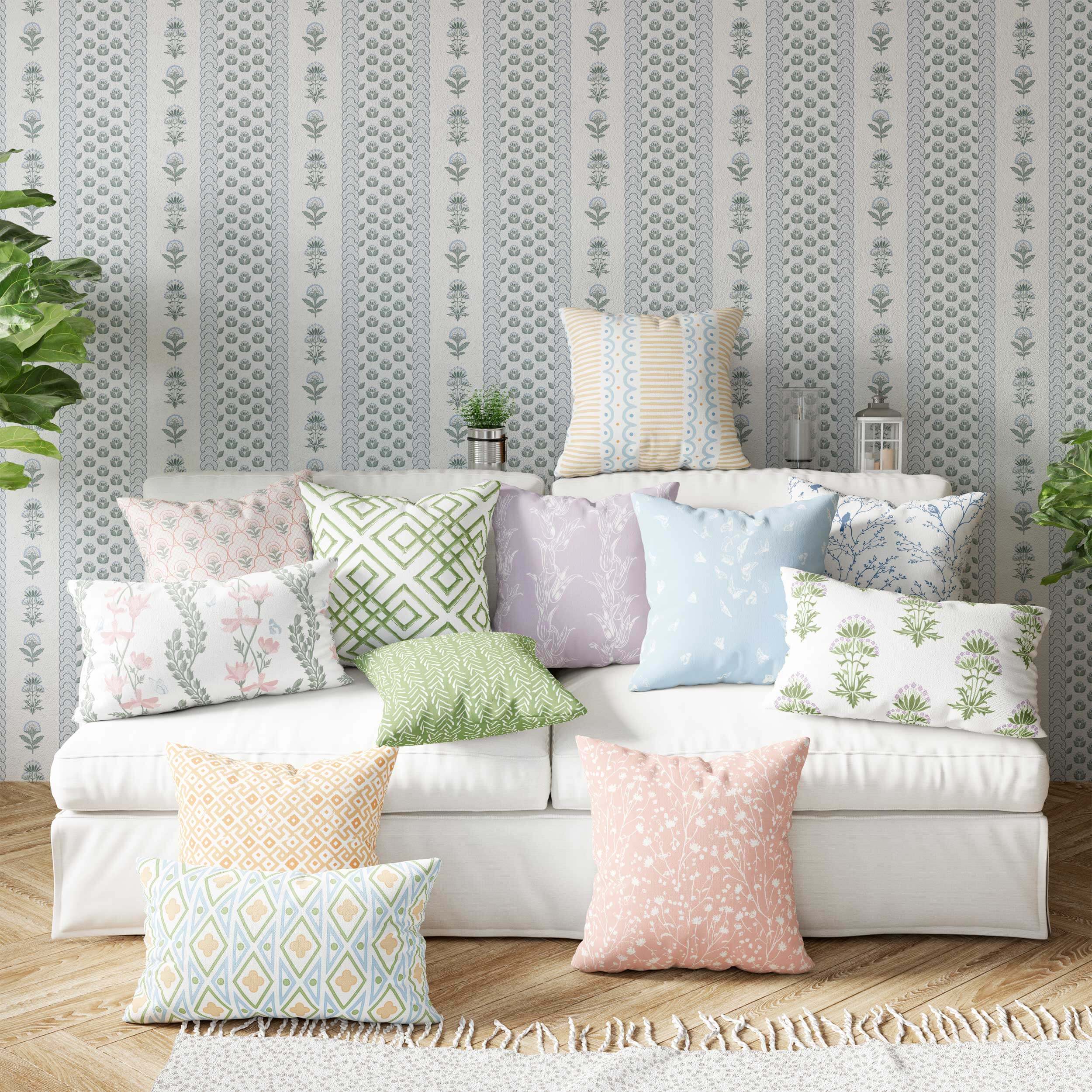 Room with sofa and pillows piled on top of sofa.